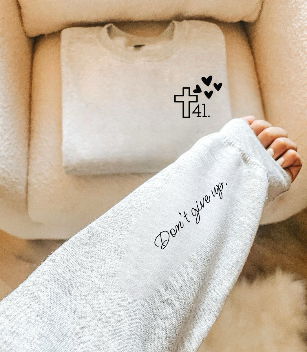 41 - Cross w/ Hearts (Left Chest) Don't Give Up - NO 41 (On Sleeve)